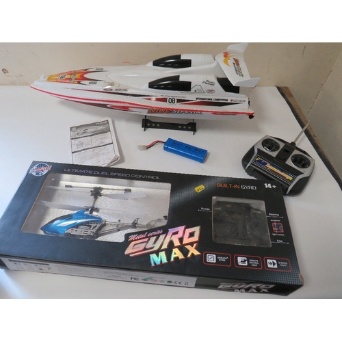 327 - A BOXED RADIO CONTROL HIGH SPEED RACING BOAT PLUS A BOXED RADIO CONTROLLED HELICOPTER (2)