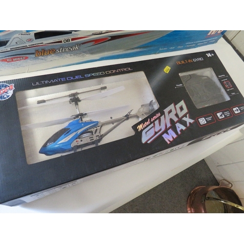 327 - A BOXED RADIO CONTROL HIGH SPEED RACING BOAT PLUS A BOXED RADIO CONTROLLED HELICOPTER (2)