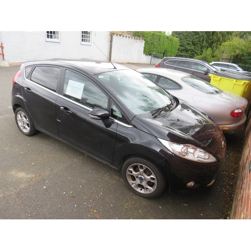 603 - A BLACK 2011 1.4L PETROL FORD FIESTA 'BF61 HVR', LOG BOOK, TWO KEYS, CURRENTLY SORN, MILEAGE AT LAST... 