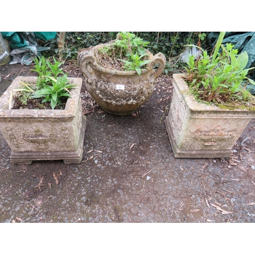 607 - THREE DECORATIVE CONCRETE GARDEN PLANTERS