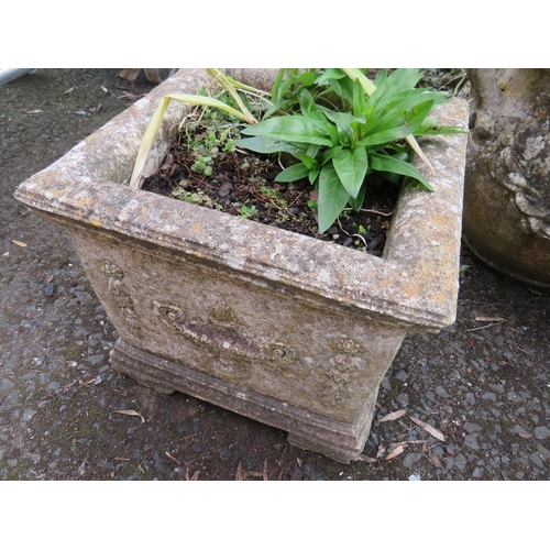 607 - THREE DECORATIVE CONCRETE GARDEN PLANTERS