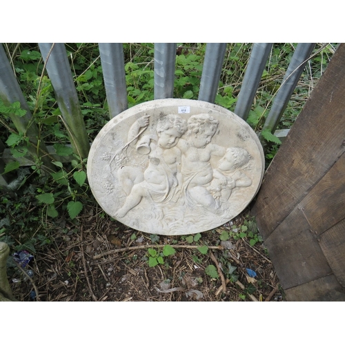 612 - A CONCRETE GARDEN HANGING WALL PLAQUE DEPICTING CHERUBS