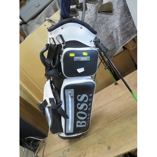 631 - A HUGO BOSS GOLF BAG AND GOLF CLUBS TO INCLUDE PING AND CALLAWAY