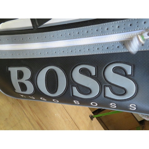 631 - A HUGO BOSS GOLF BAG AND GOLF CLUBS TO INCLUDE PING AND CALLAWAY