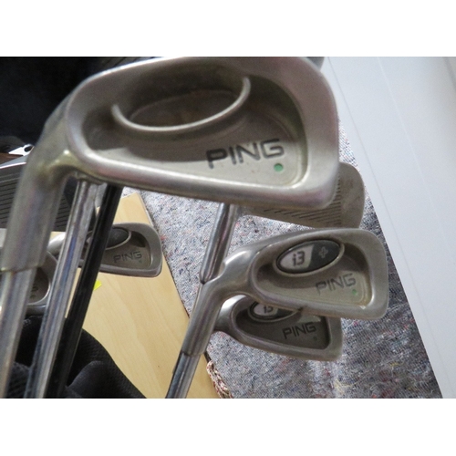 631 - A HUGO BOSS GOLF BAG AND GOLF CLUBS TO INCLUDE PING AND CALLAWAY