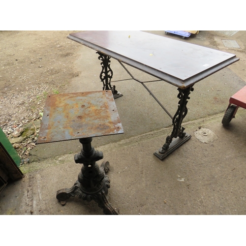 645 - A CAST IRON TABLE AND A PEDESTAL TABLE BASE