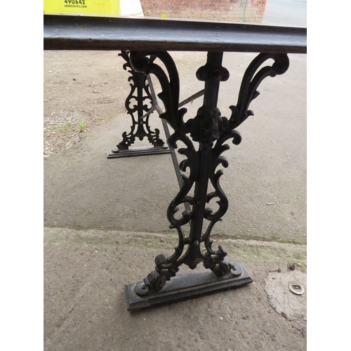 645 - A CAST IRON TABLE AND A PEDESTAL TABLE BASE