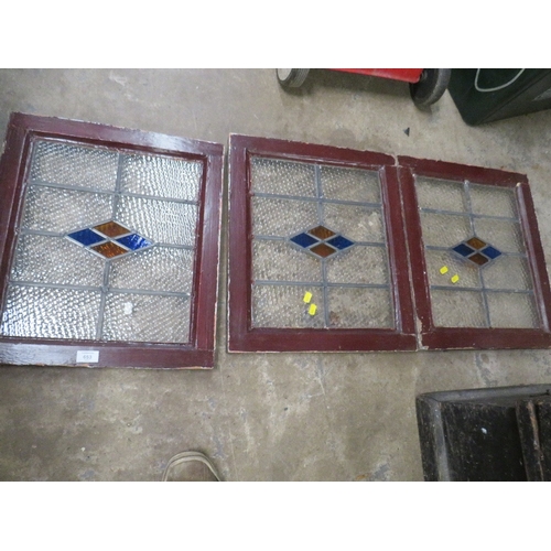 653 - THREE FRAMED LEADED LIGHT WINDOW PANELS