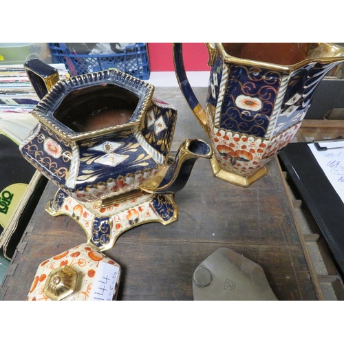 144 - A VICTORIAN STYLE TEAPOT AND STAND TOGETHER WITH A WATER JUG IN IMARI COLOURS A/F