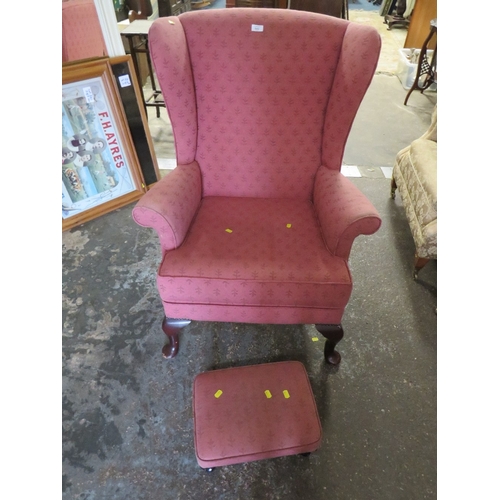 842 - A QUEEN ANNE STYLE WINGED BACK CHAIR AND STOOL