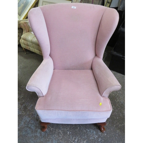 843 - A QUEEN ANNE STYLE WINGED BACK CHAIR