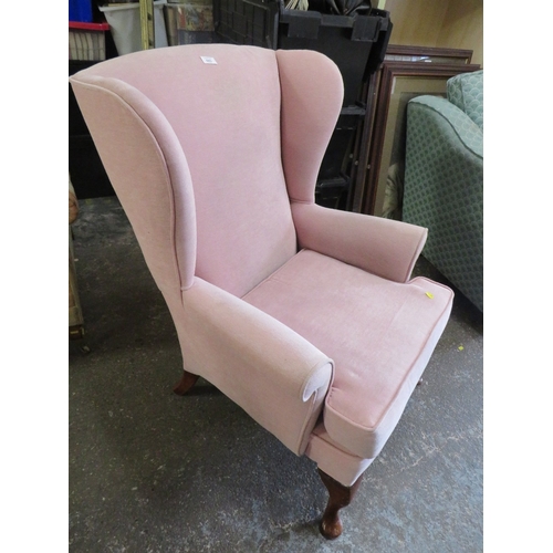 843 - A QUEEN ANNE STYLE WINGED BACK CHAIR