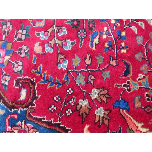 846 - AN ORIENTAL RUG - 330 X 225 CM