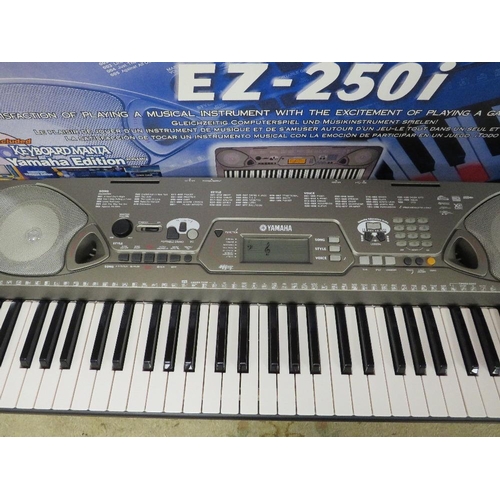 128 - A BOXED YAMAHA PORTATONE EZ250i KEYBOARD WITH ACCESSORIES