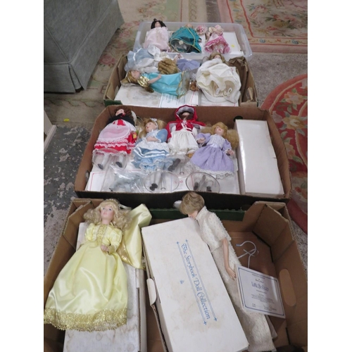 141 - FOUR TRAYS OF DANBURY MINT STORY COLLECTION PORCELAIN DOLLS WITH SOME CERTIFICATES AND BOXES