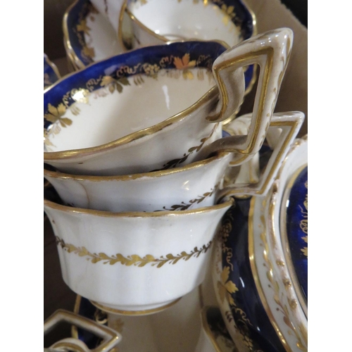 187 - A  TRAY OF BLUE AND GILT TEA WARE