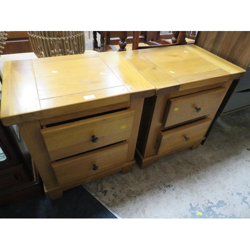 765 - A PAIR OF LIGHT OAK BEDSIDE CHESTS