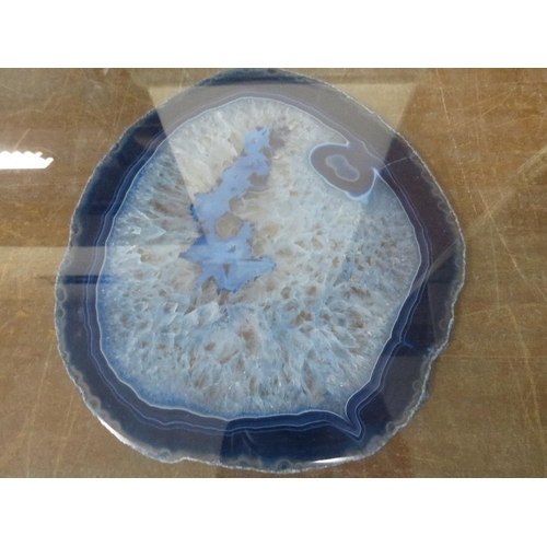 8 - A GLASS FRAMED BLUE AGATE SLICE