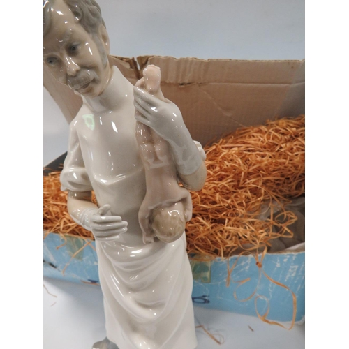 326 - A LLADRO FIGURE OF A DOCTOR HOLDING A NEW BORN BABY TOGETHER WITH A LLADRO FIGURE OF A NURSE IN ORIG... 