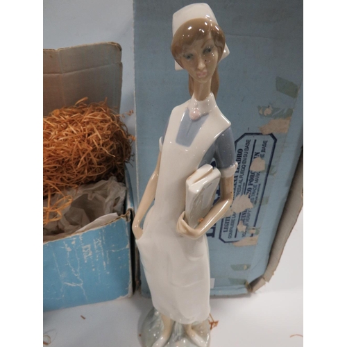 326 - A LLADRO FIGURE OF A DOCTOR HOLDING A NEW BORN BABY TOGETHER WITH A LLADRO FIGURE OF A NURSE IN ORIG... 