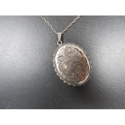 403 - A LARGE ENGRAVED SILVER LOCKET, CUFFLINKS ETC