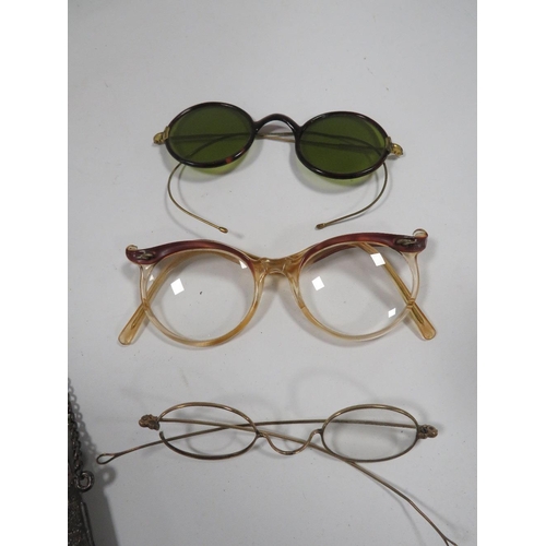 409 - A COLLECTION OF VINTAGE SPECTACLES AND WHITE METAL SPECTACLE HOLDERS ETC TO INCLUDE A VINTAGE PAIR O... 