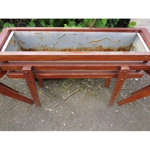 603 - THREE WOODEN PLANT TROUGHS ON LEGS