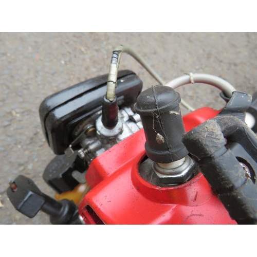 641 - A KAWASAKI TG24 PETROL STRIMMER AND A HOMELITE PETROL CHAINSAW (2)