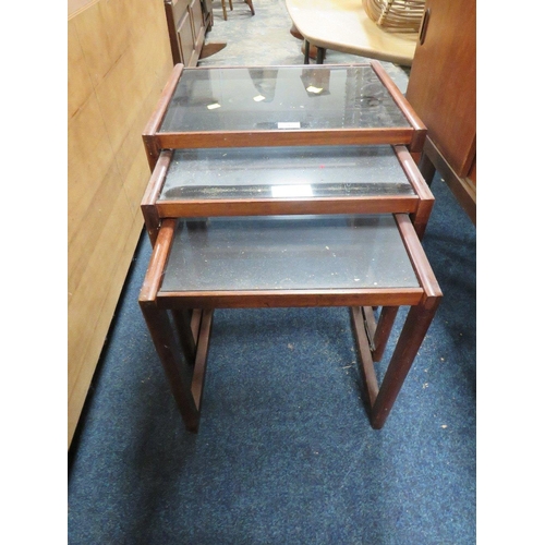 792 - A MID CENTURY NEST OF TABLES WITH GLASS TOPS A/F