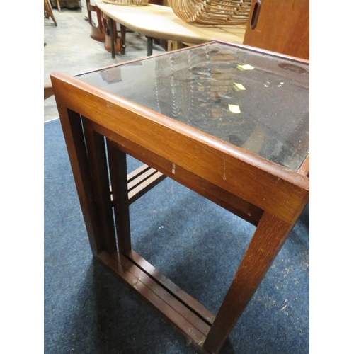 792 - A MID CENTURY NEST OF TABLES WITH GLASS TOPS A/F