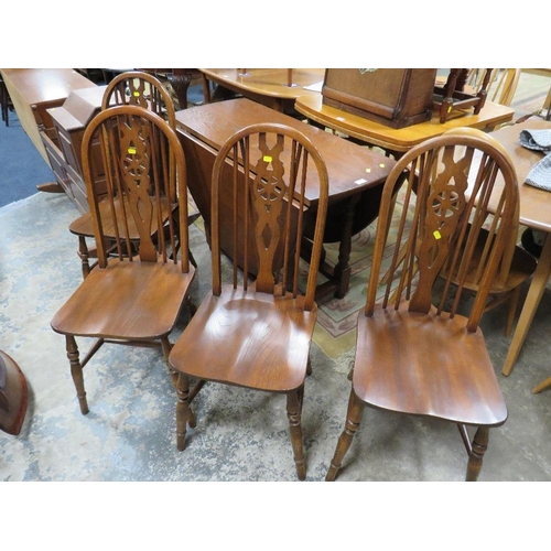 800 - AN OLD CHARM OAK DROPLEAF TABLE WITH FOUR WHEELBACK CHAIRS