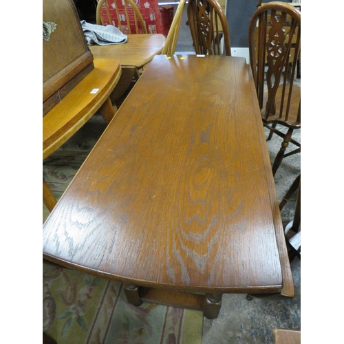 800 - AN OLD CHARM OAK DROPLEAF TABLE WITH FOUR WHEELBACK CHAIRS