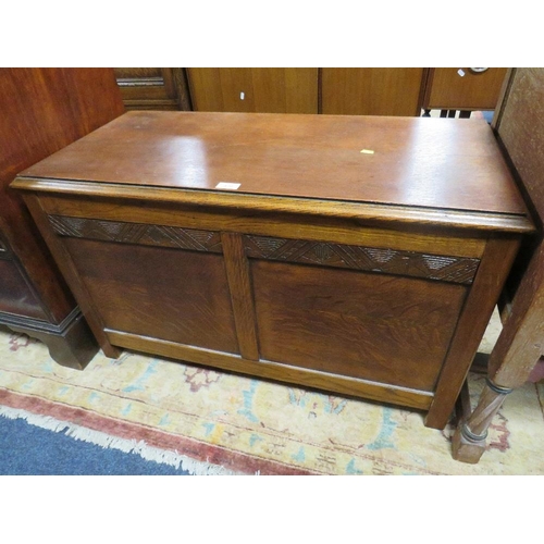 810 - AN OAK PANELLED COFFER