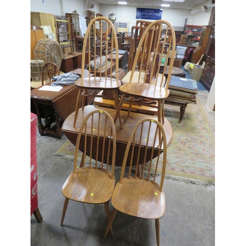 813 - AN ERCOL STYLE DROPLEAF TABLE WITH FOUR HOOPBACK CHAIRS