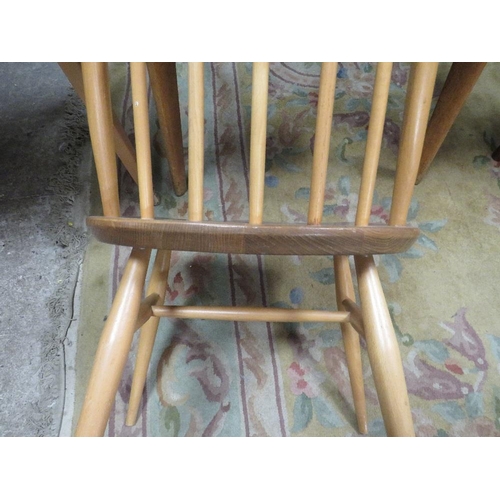 813 - AN ERCOL STYLE DROPLEAF TABLE WITH FOUR HOOPBACK CHAIRS