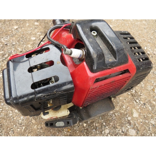 654 - A LARGE PETROL STRIMMER WITH EXTRA ATTACHMENTS