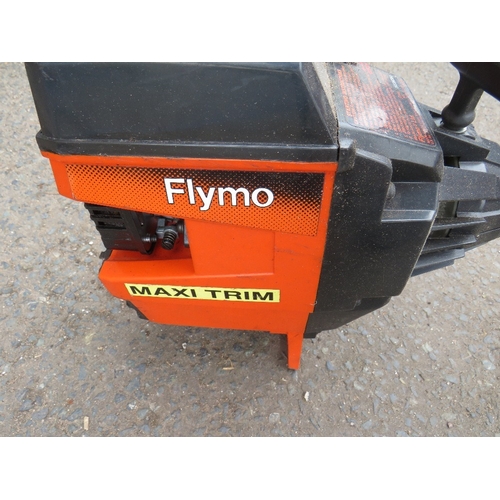 657 - A FLYMO MAXI TRIM PETROL STRIMMER