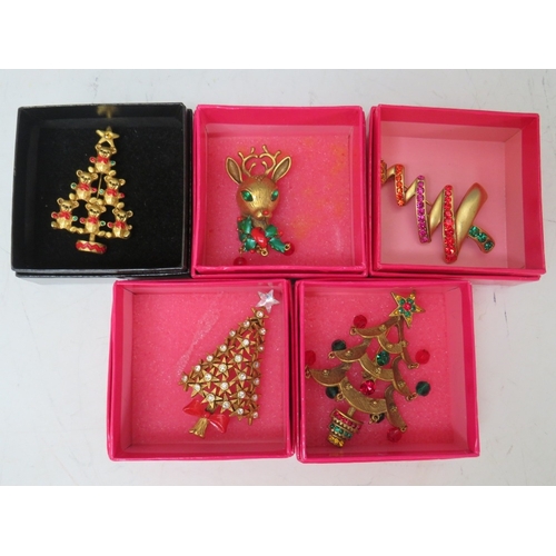 6 - A SELECTION OF FOUR BUTLER AND WILSON CHRISTMAS TREE BROOCHES, together with a Butler and Wilson rei... 