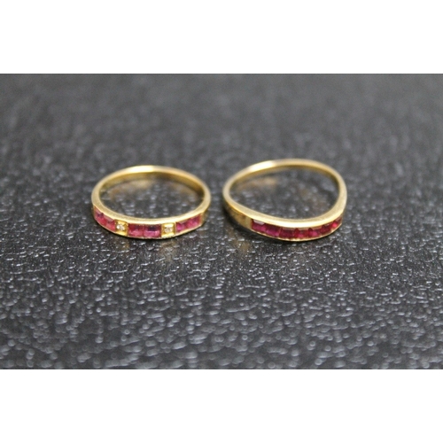 94 - TWO 14K RUBY RINGS, one set with two diamonds - size L, the other on a twist band - size O, approx c... 