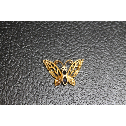 109 - A NOVELTY YELLOW METAL SAPPHIRE AND DIAMOND PENDANT IN THE FORM OF A BUTTERFLY, approx weight 1.7g, ... 