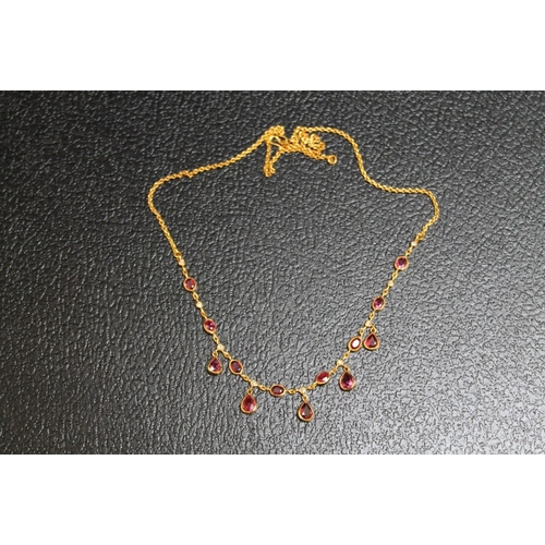 110 - A YELLOW METAL RUBY AND DIAMOND NECKLACE, on a simple s shaped attachment, approx weight 8.4g, L 43 ... 