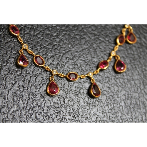 110 - A YELLOW METAL RUBY AND DIAMOND NECKLACE, on a simple s shaped attachment, approx weight 8.4g, L 43 ... 