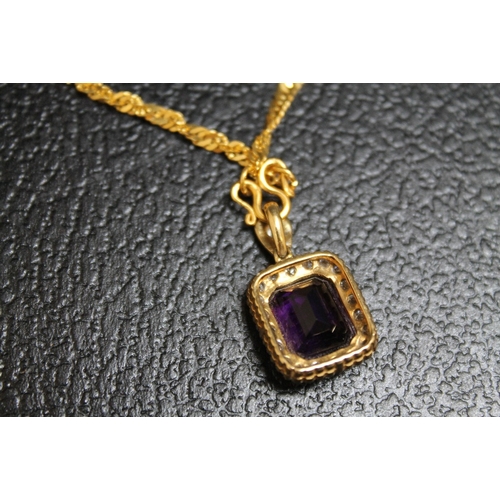 114 - AN AMETHYST AND DIAMOND PENDANT, set in unmarked yellow metal on an unmarked yellow metal chain with... 