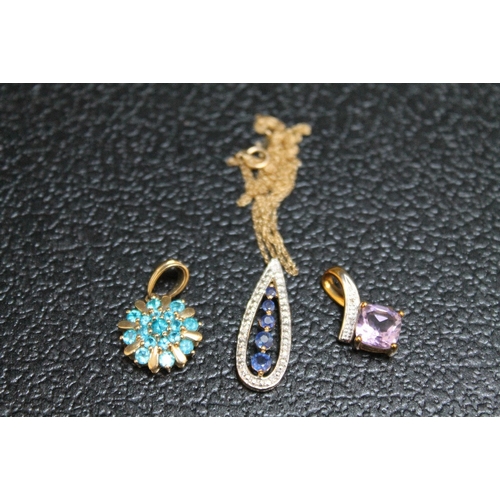 135 - THREE 9 CARAT GOLD PENDANTS TO INCLUDE AN AMETHYST EXAMPLE. approx combined weight 5.6g