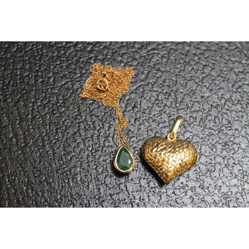 136 - A 9 CARAT GOLD TEARDROP EMERALD PENDANT ON CHAIN, together with a 9 carat gold heart pendant, approx... 