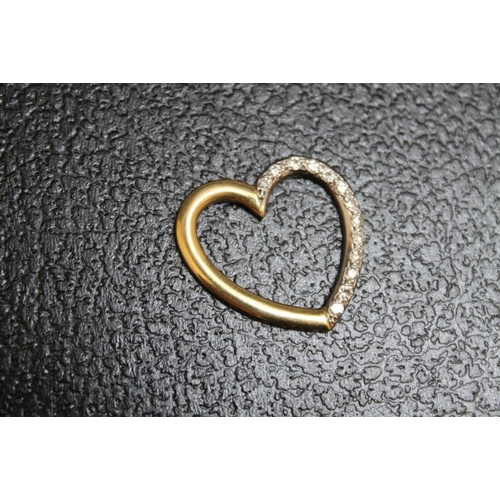 138 - AN 18 CARAT GOLD DIAMOND SET TWO COLOUR GOLD HEART PENDANT, approx weight 4.9g, W 2.5 cm