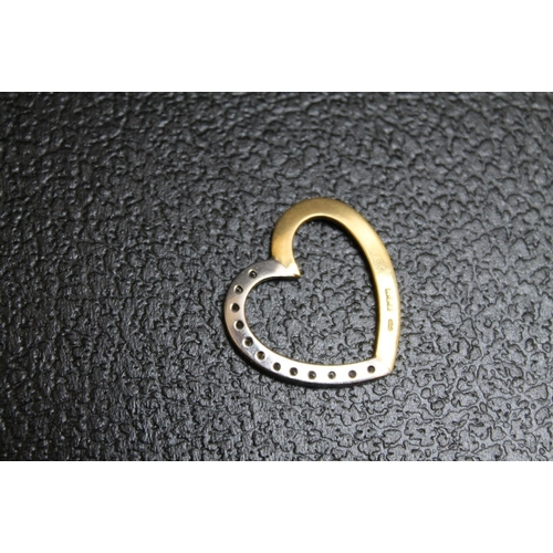 138 - AN 18 CARAT GOLD DIAMOND SET TWO COLOUR GOLD HEART PENDANT, approx weight 4.9g, W 2.5 cm