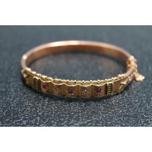 142 - AN ANTIQUE HALLMARKED 9 CARAT GOLD BANGLE SET WITH RUBIES AND DIAMONDS - BIRMINGHAM 1917,  in fitted... 