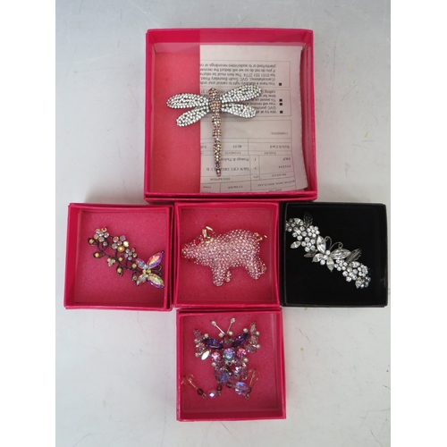 15 - THREE  BUTLER AND WILSON BUTTERFLY THEMED BROOCHES, largest W 7 cm, together with a dragonfly brooch... 