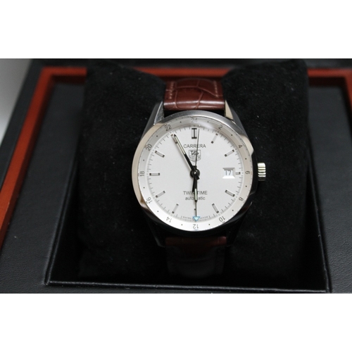 152 - TAG HEUER - A BOXED CARRERA TWIN-TIME AUTOMATIC WRIST WATCH, on leather strap, complete with instruc... 